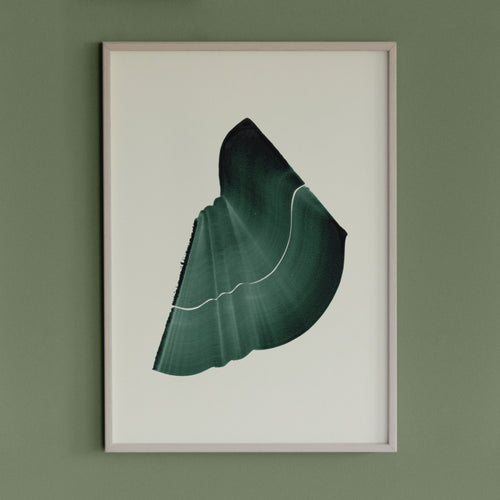 Deep forest green abstract artwork in a thin white oak wooden frame on a sage green wall