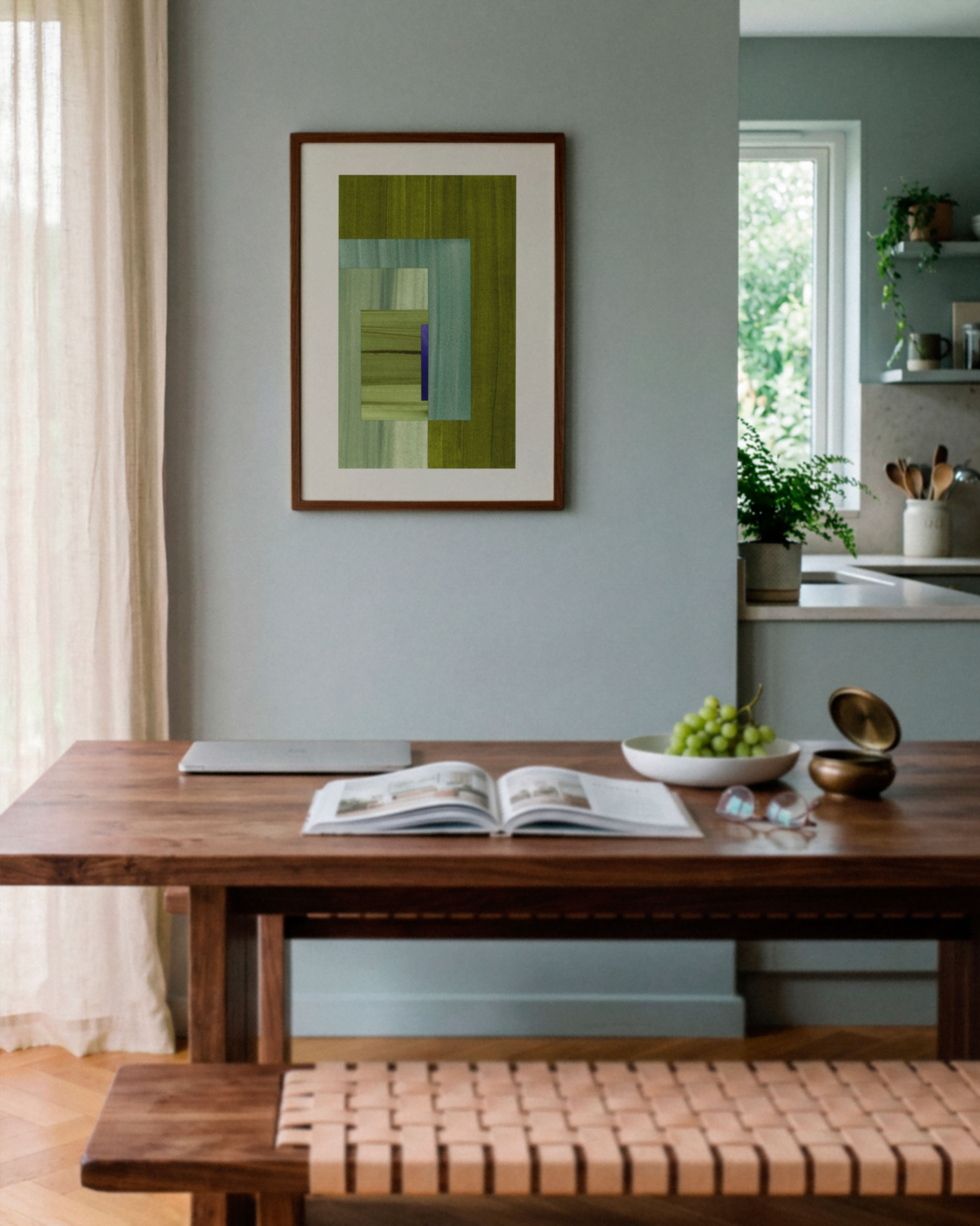 Sky blue dining room with walnut wooden table, and moss green abstract art on the wall.