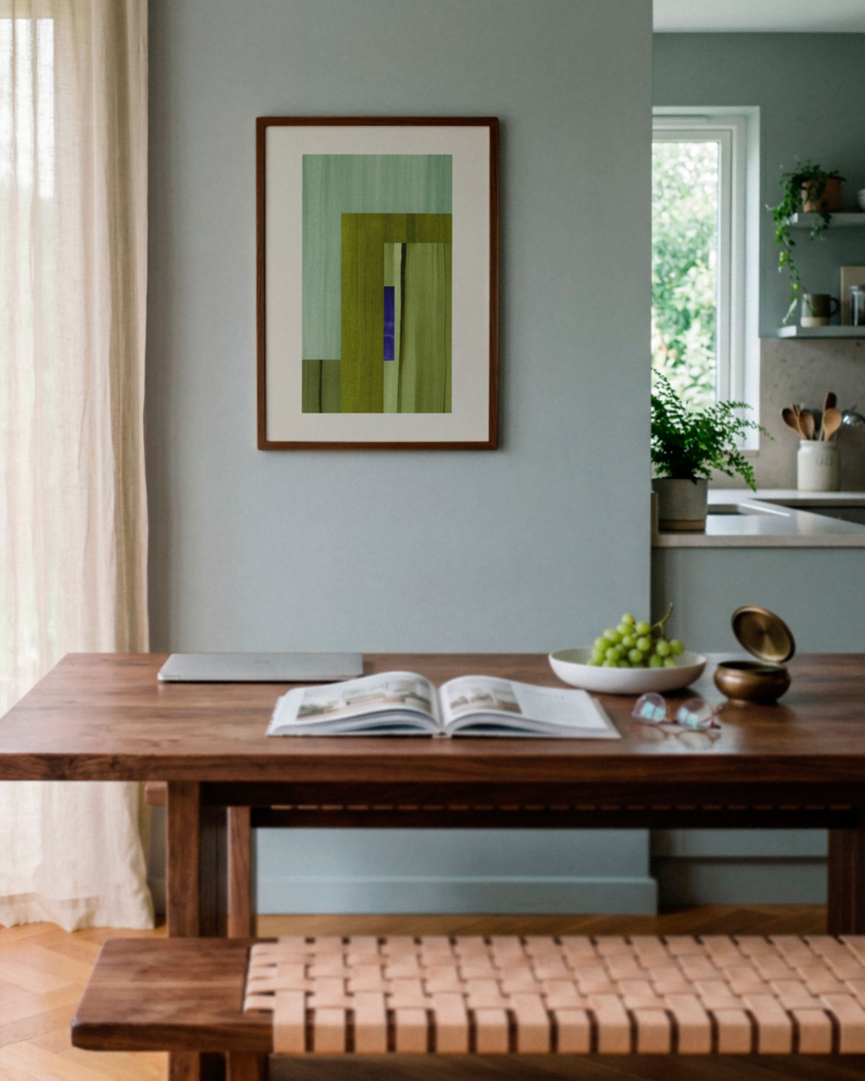 Sky blue dining room with walnut wooden table, and abstract art on the wall.