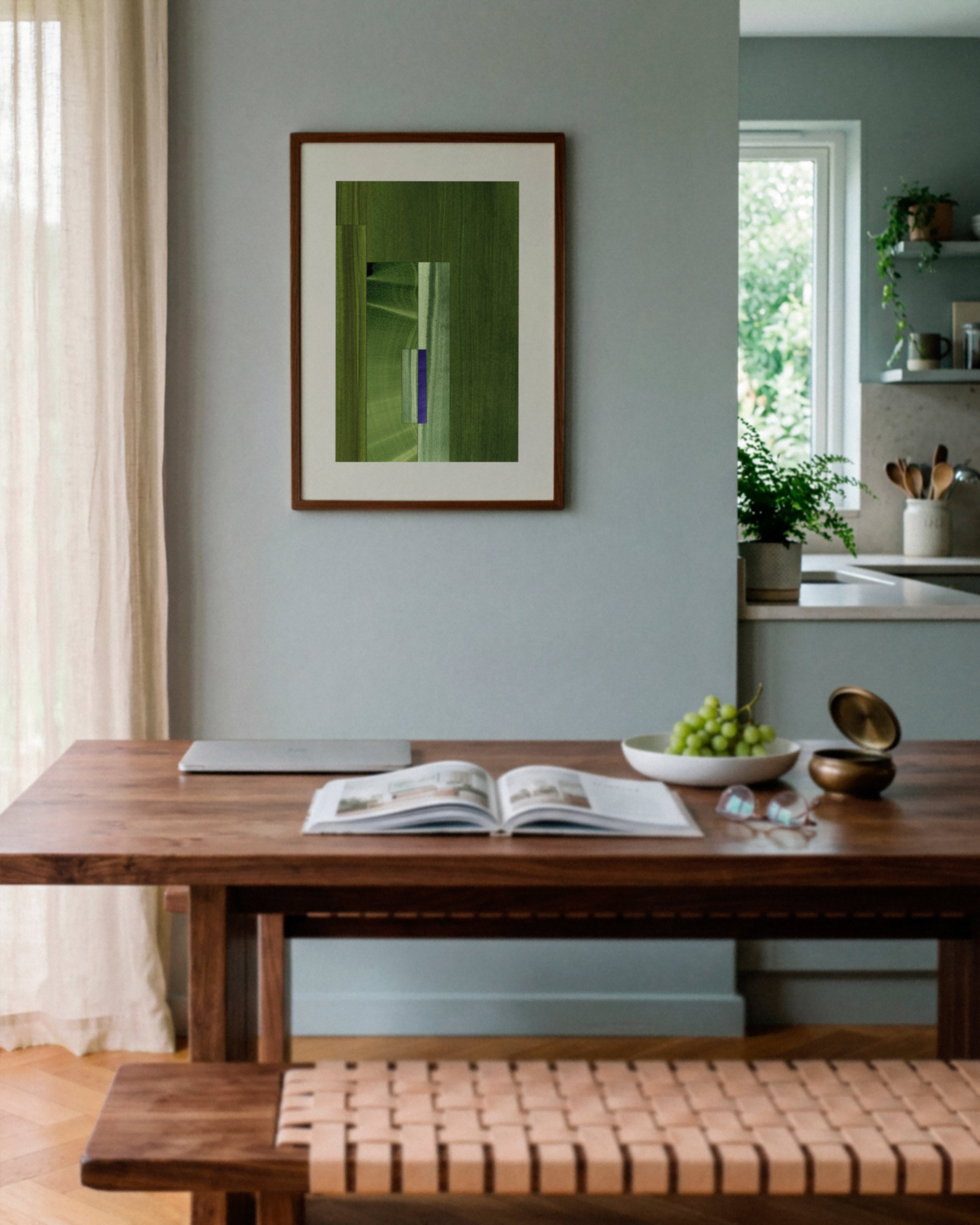 Sky blue dining room with walnut wooden table, and green abstract art on the wall.