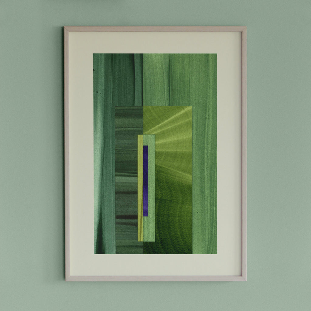 Framed geometric abstract art piece with grass green and blue colours on a light green wall.