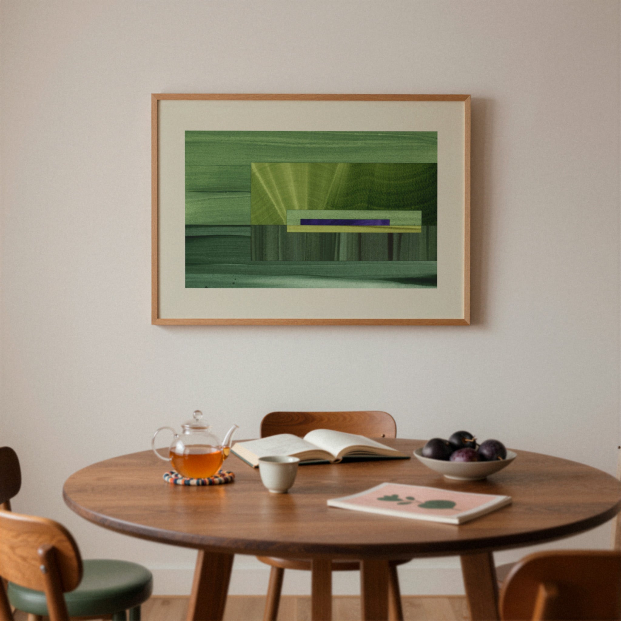 Mid century dining room with a wooden table, chairs, and a framed green abstract artwork on the wall.