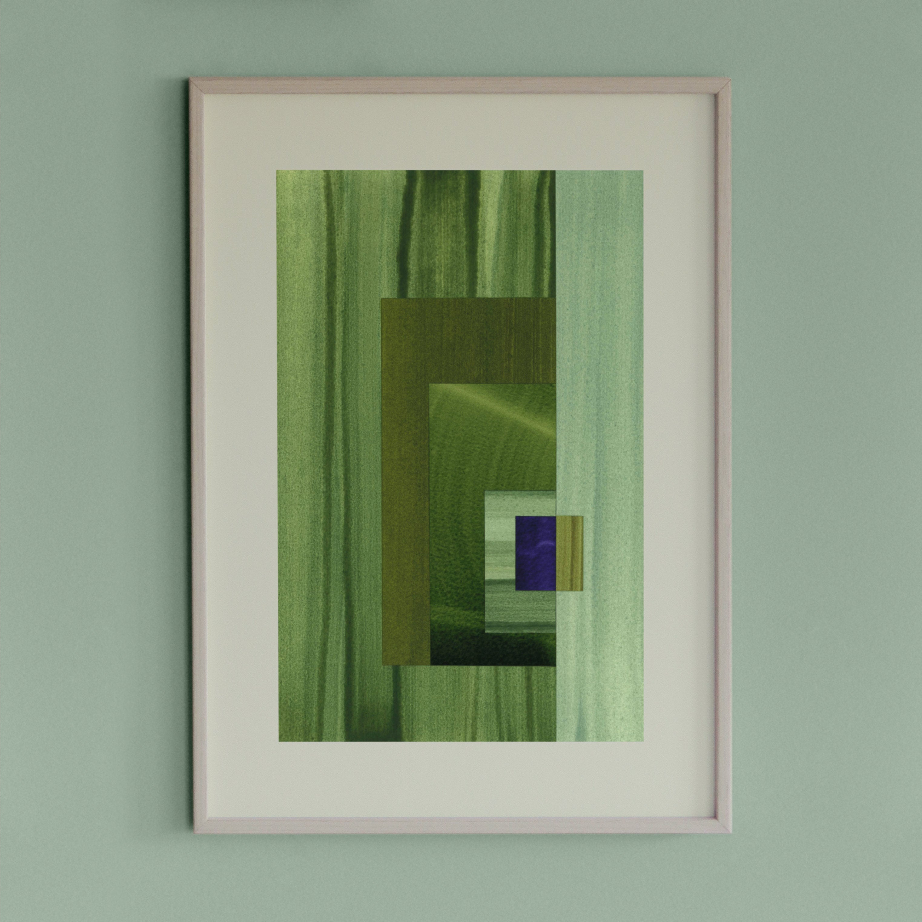 Framed geometric abstract art piece with grass green, mint and blue colours on a light green wall.