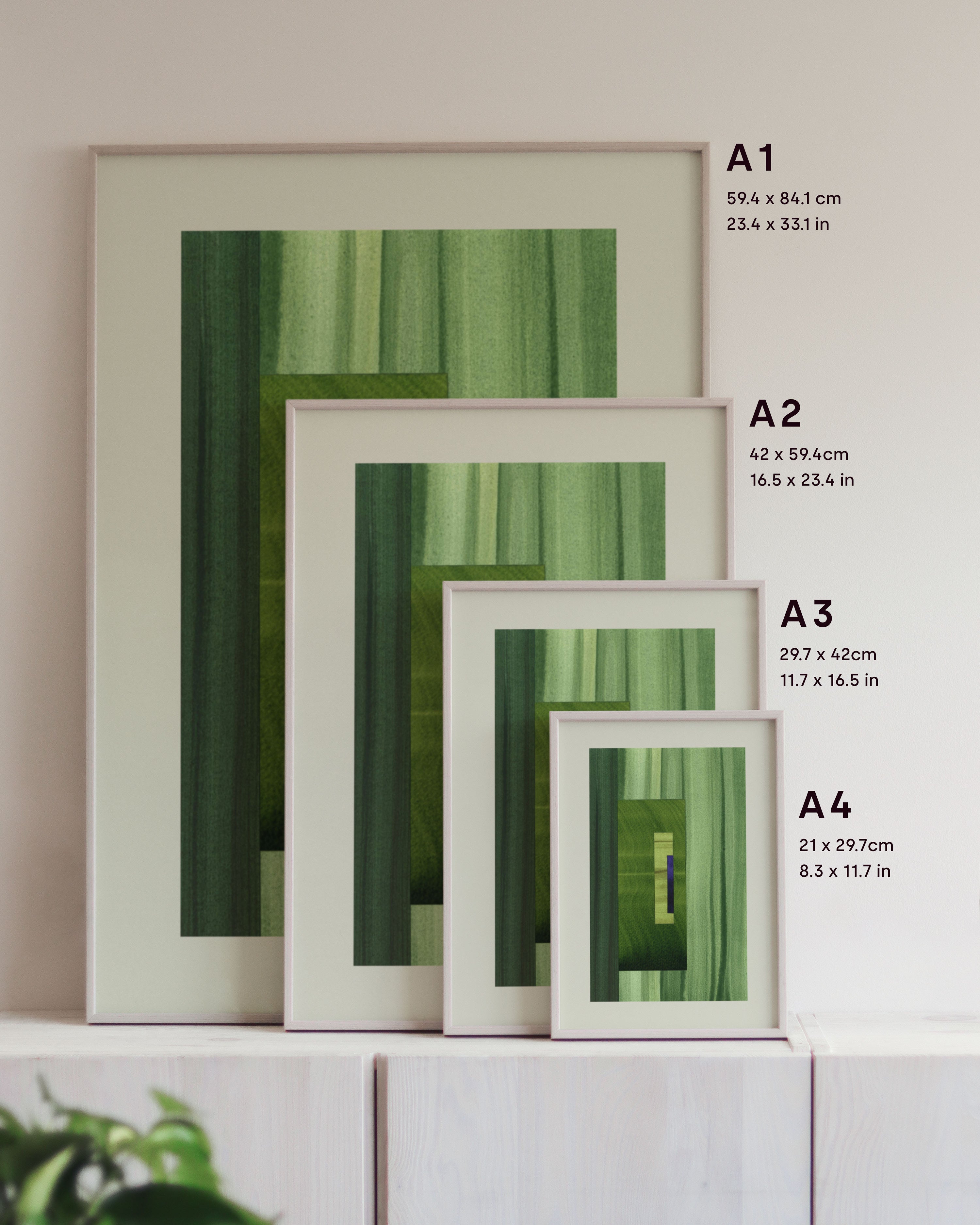 Framed green abstract art prints on a neutral background, showing in sizes A4, A3, A2 and A1.