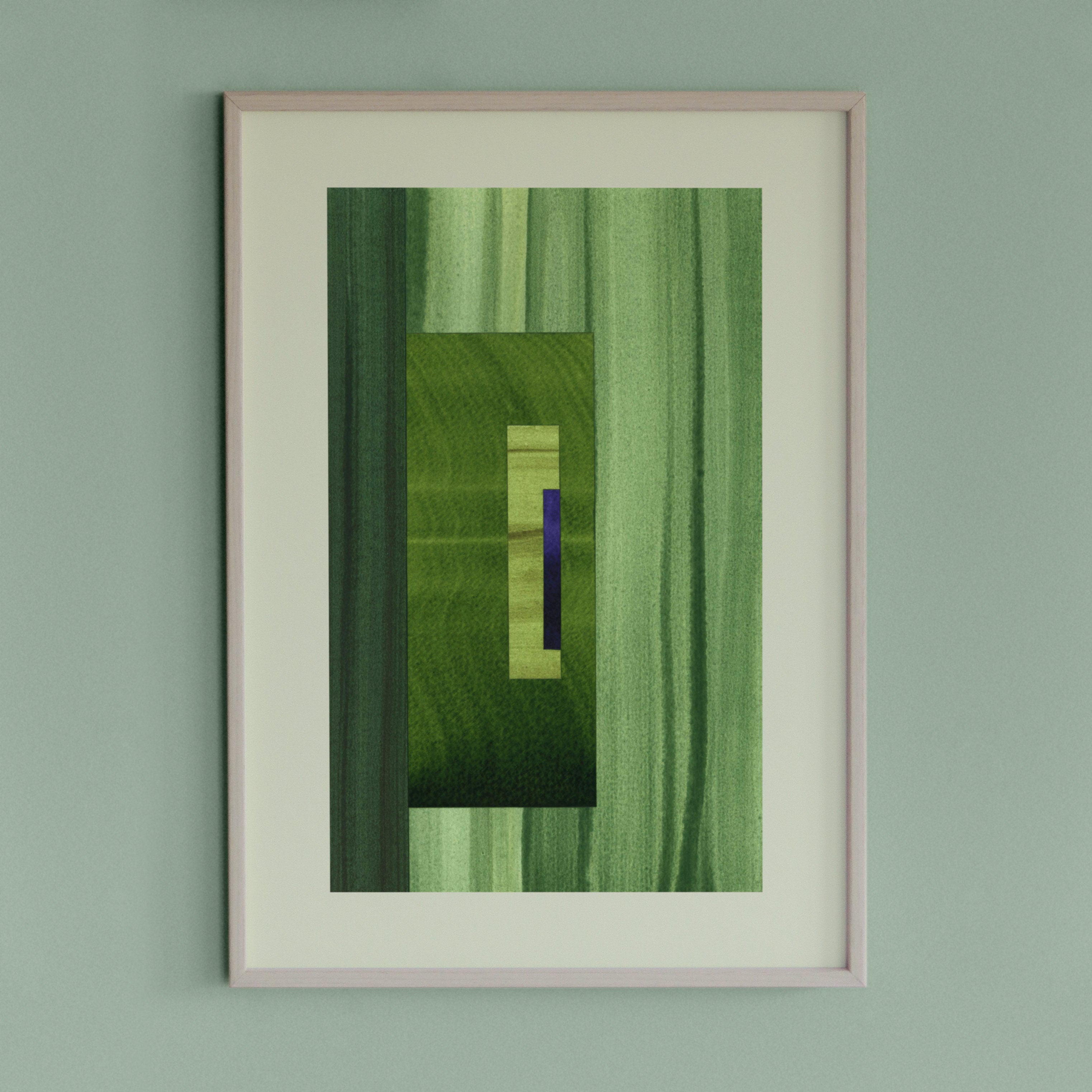 Framed geometric abstract art piece with grass green and blue colours on a light green wall.