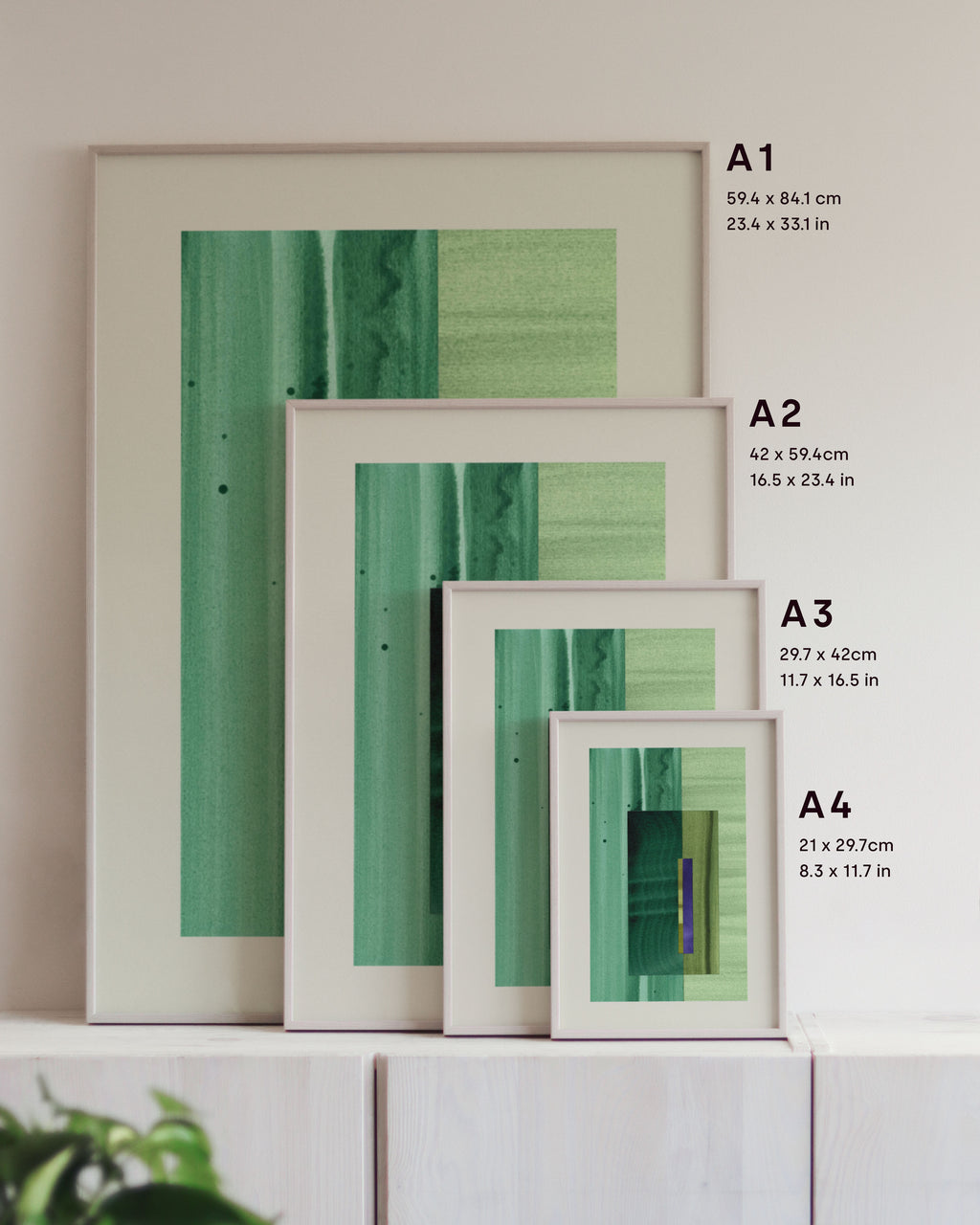 Framed green abstract art prints on a neutral background, showing in sizes A4, A3, A2 and A1.
