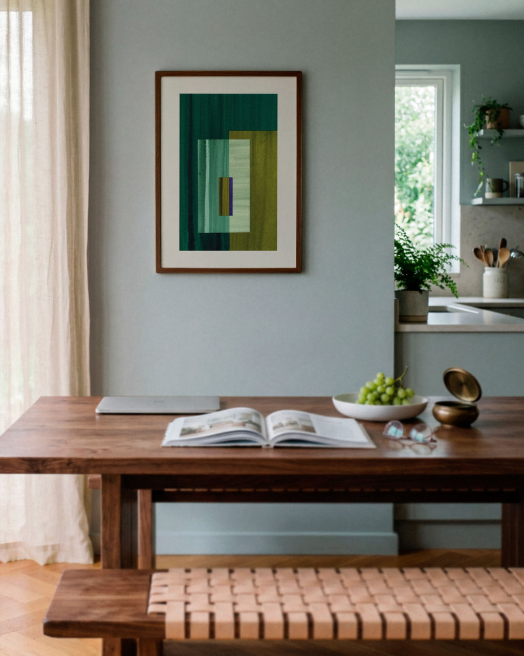 Sky blue dining room with walnut wooden table, and green abstract art on the wall.