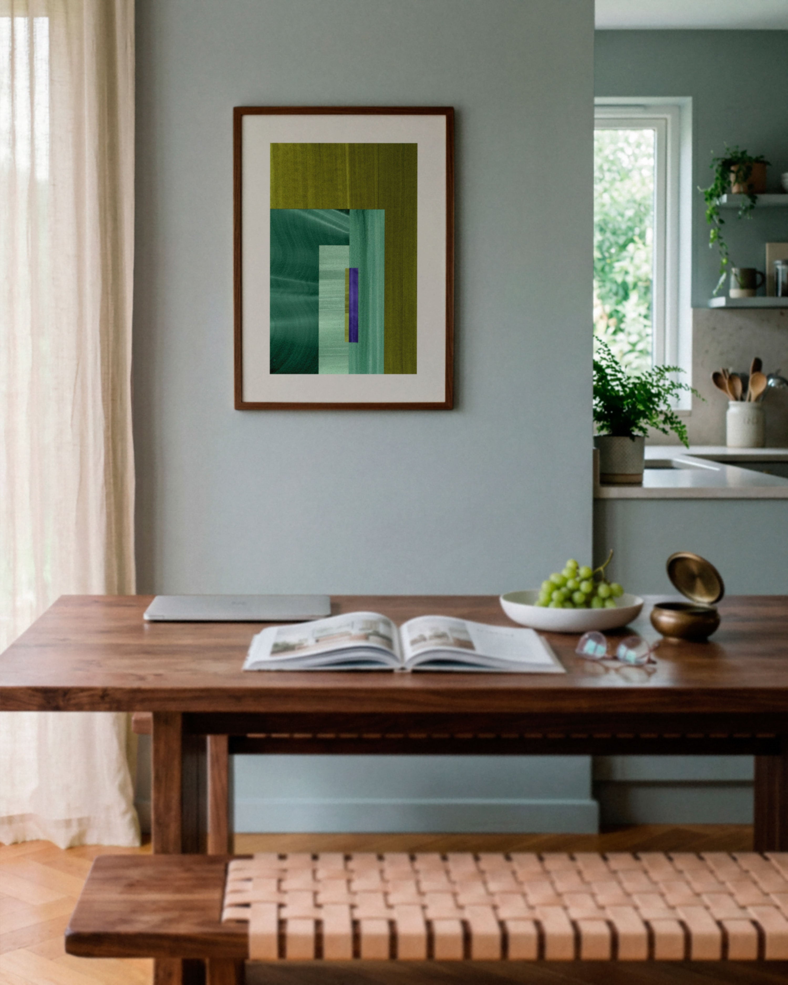 Sky blue dining room with walnut wooden table, and green abstract art on the wall.