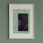 Geometric abstract artwork with turquoise, blue and aubergine purple colours, in a thin white oak wooden frame on a teal/aquamarine grey wall