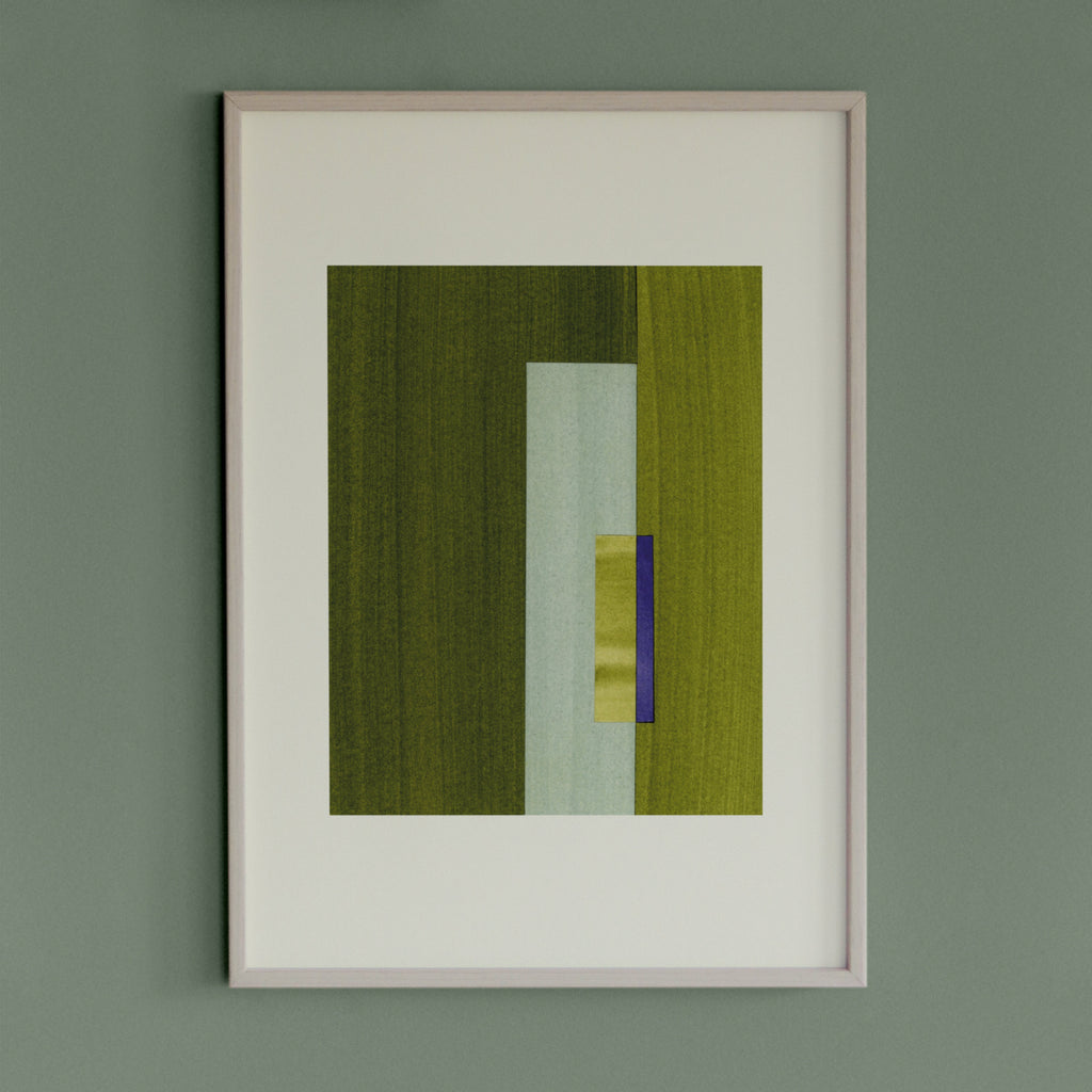 Geometric abstract artwork with green and blue/purple colours, in a thin white oak wooden frame on a teal/aquamarine grey wall