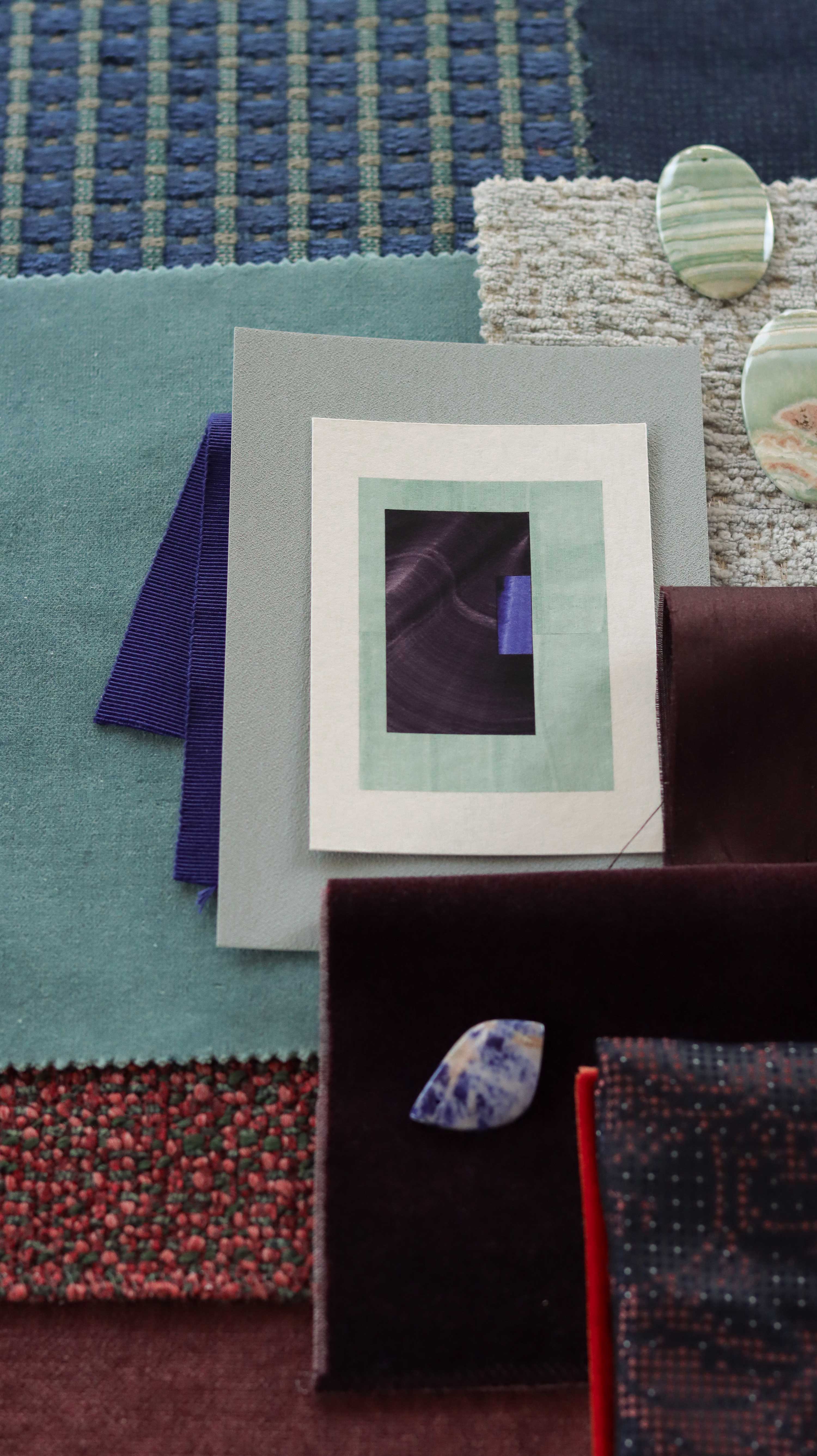 Turquoise and eggplant purple geometric abstract art print samples with fabric swatches. Inspiration for teal, rust, duck egg blue and chocolate brown themed interior decor.