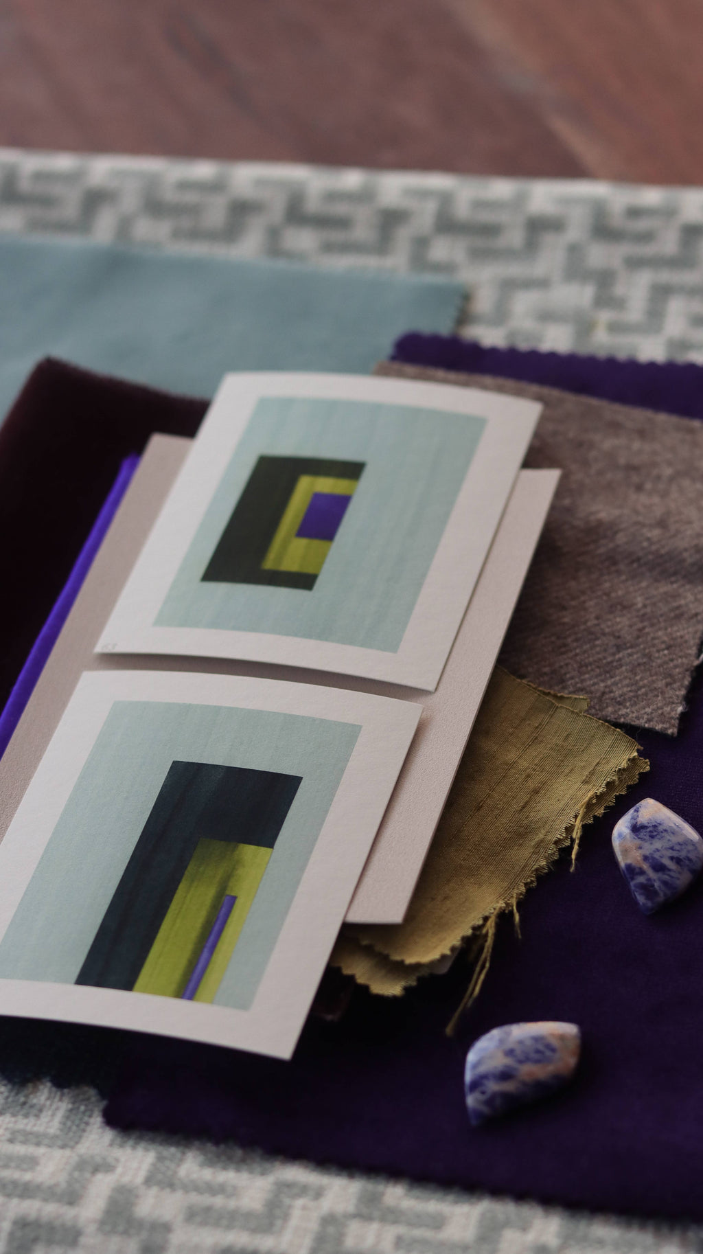 Turquoise, yellow and royal blue geometric abstract art print samples with fabric swatches. Inspiration for blue, grey and earth tone themed interior decor.