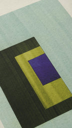 Geometric abstract artwork, fine art print. Close-up detail shot of abstract artwork with rectangular shapes in light turquoise, olive green and royal blue/purple on cream textured bamboo paper, showcasing the high quality and fine details.