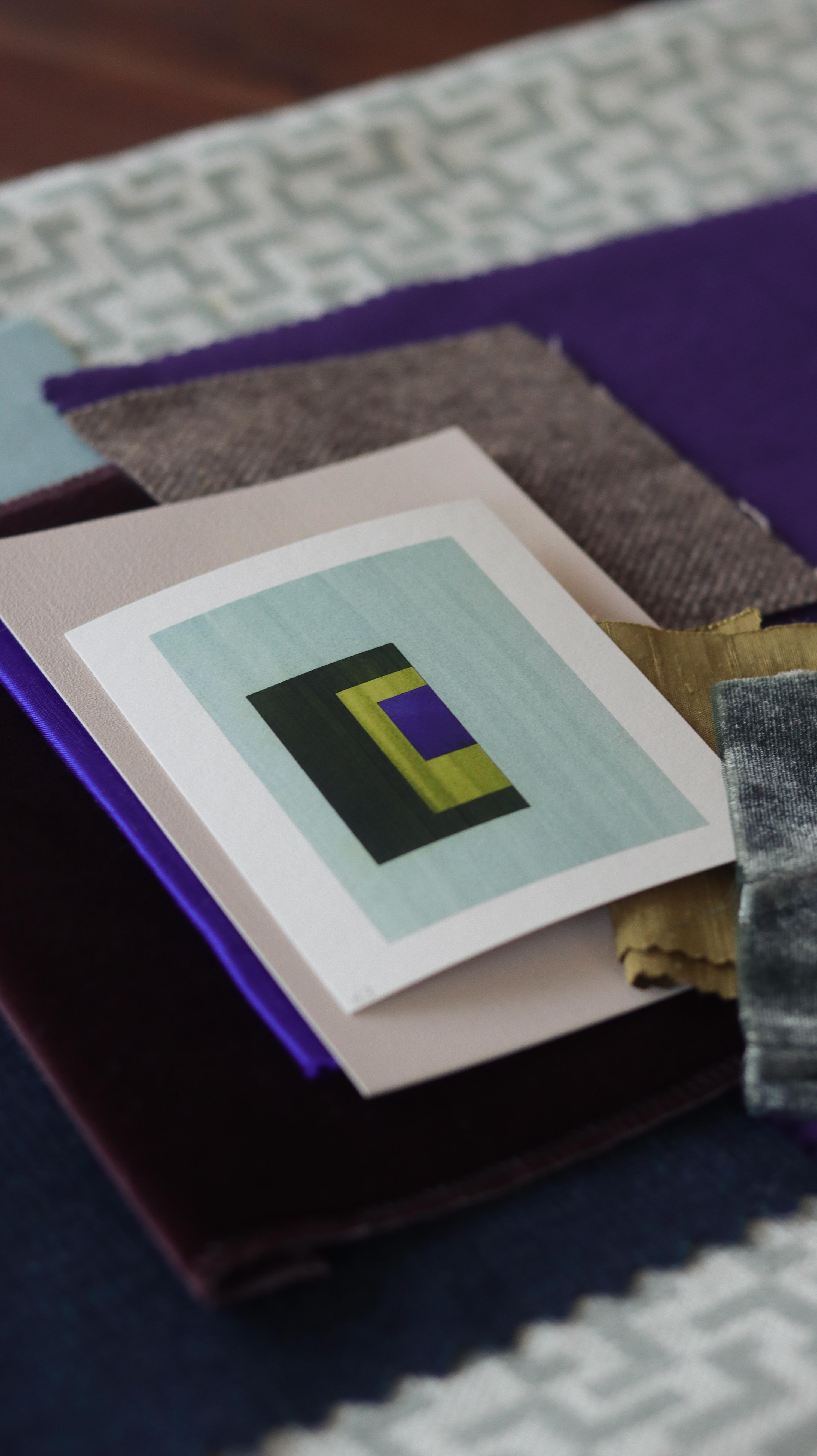 Turquoise, blue and green geometric abstract art print samples with fabric swatches. Inspiration for teal and blue themed interior decor.